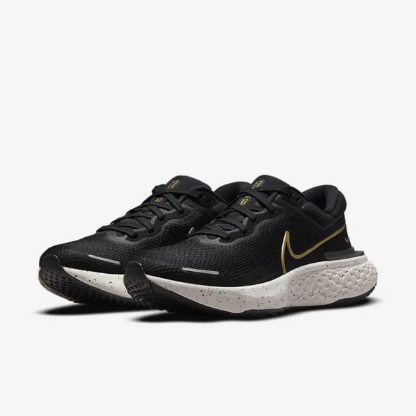 Nike ZoomX Invincible Run Flyknit Road Men's Running Shoes Black / Metal Gold | NK523LWO